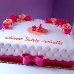 tort na chrzciny z bobaskiem i rozami